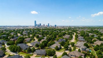 Residential neighborhoods and downtown Oklahoma City skyline highlighting July 2026 housing market activity